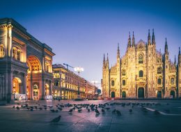 Stunning view of the Duomo Cathedral in Milan, showcasing its intricate Gothic architecture and majestic spires under a clear sky